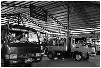 Busses and sign at base station. Kyaiktiyo, Myanmar ( black and white)