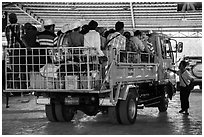 Bus leaving base station with 35 passengers in the back. Kyaiktiyo, Myanmar ( black and white)