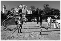 Young men play chin lone (kick volleyball) at Yatetaung. Kyaiktiyo, Myanmar ( black and white)