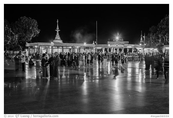 Crowds on main plaza at night. Kyaiktiyo, Myanmar (black and white)