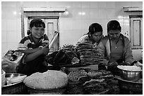 Food vendors reading, Potemkin village. Kyaiktiyo, Myanmar ( black and white)