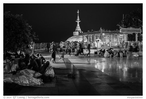 Pilgrims wake up after sleeping on plaza behind Golden Rock. Kyaiktiyo, Myanmar (black and white)