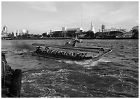 Crowded long tail taxi boat on Chao Phraya river. Bangkok, Thailand ( black and white)