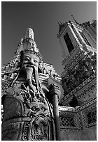 Statue and tower, Wat Arun. Bangkok, Thailand ( black and white)
