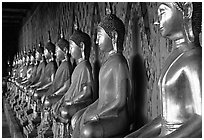 Row of Buddha figures, Wat Arun. Bangkok, Thailand ( black and white)