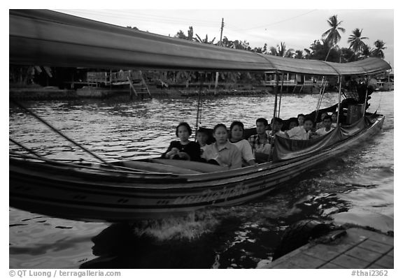 Evening commute, long tail taxi boat on canal. Bangkok, Thailand (black and white)