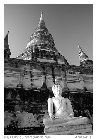 Buddha statue and Wat Chai Mongkon. Ayutthaya, Thailand (black and white)