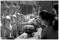 Worshiper makes offering at Wat Phra That Doi Suthep. Chiang Mai, Thailand ( black and white)