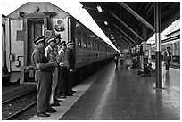 Train platform and attendants. Bangkok, Thailand ( black and white)
