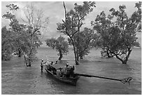 Longtail boat set to depart through mangroves, Rai Leh. Krabi Province, Thailand (black and white)