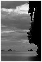 Seascape with limestone islets, stalactite, dusk, Andamam Sea. Krabi Province, Thailand ( black and white)