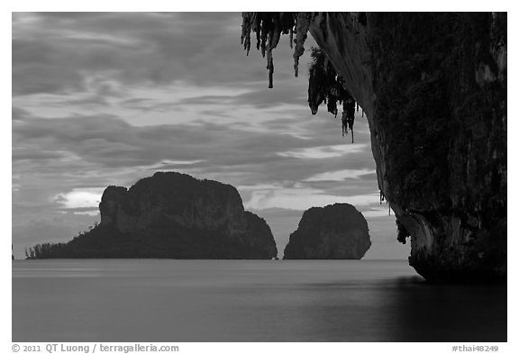 Limestone stalactite framing islets, Rai Leh. Krabi Province, Thailand (black and white)