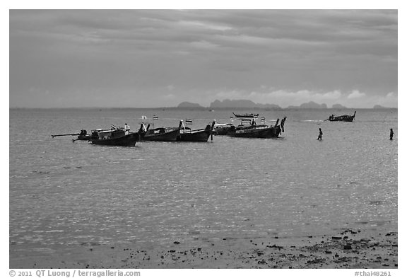 Boats anchored at low tide, storm sky,  Railay East. Krabi Province, Thailand (black and white)
