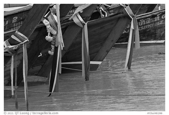 Prows of longtail boats with garlands, Ko Phi-Phi Don. Krabi Province, Thailand (black and white)