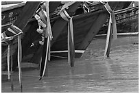 Prows of longtail boats with garlands, Ko Phi-Phi Don. Krabi Province, Thailand (black and white)
