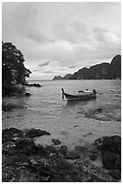 Boat in cove, Ko Phi-Phi island. Krabi Province, Thailand (black and white)