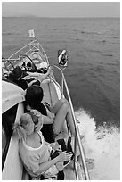 Women sitting on front of boat. Krabi Province, Thailand (black and white)