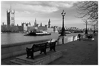 Riverfront promenade, Thames River, and Westminster Palace. London, England, United Kingdom (black and white)