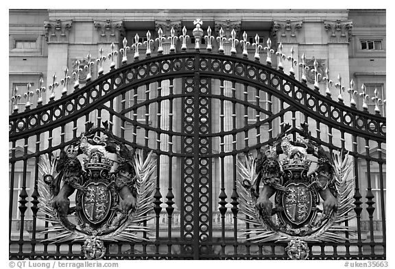 Entrance grids of Buckingham Palace with royalty emblems. London, England, United Kingdom