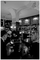 Talking around a drink in the pub Westmister Arms. London, England, United Kingdom ( black and white)