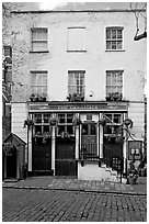 Pub the Grenadier, and cobblestone mews. London, England, United Kingdom ( black and white)