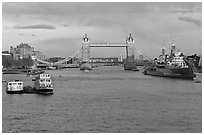 Thames River, Tower Bridge, HMS Belfast, late afternoon. London, England, United Kingdom (black and white)