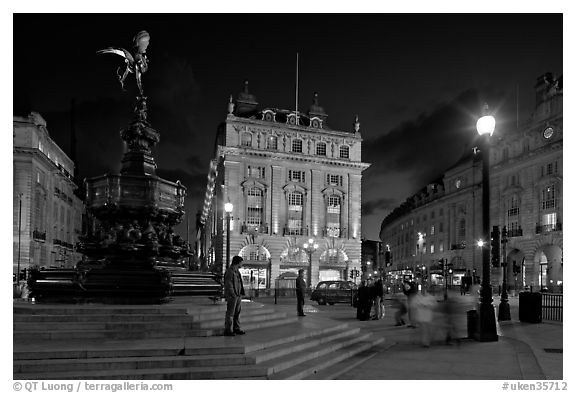 Piccadilly Circus and Eros statue at night. London, England, United Kingdom (black and white)