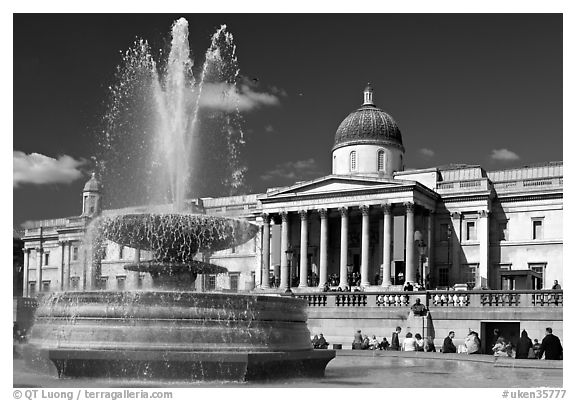 Fountain and National Gallery, Trafalgar Square, mid-day. London, England, United Kingdom