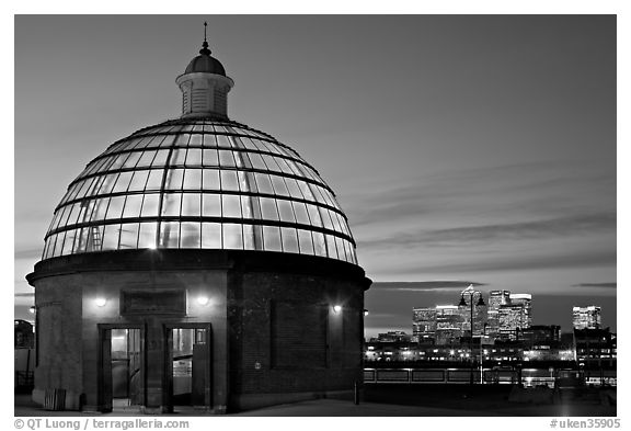 Entrance of foot tunnel under the Thames and Docklands buildings at dusk. Greenwich, London, England, United Kingdom (black and white)