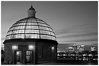 Entrance of foot tunnel under the Thames and Docklands buildings at dusk. Greenwich, London, England, United Kingdom (black and white)