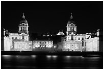 Old Royal Naval College, Queen's house, and Royal observatory with laser marking the Prime meridian at night. Greenwich, London, England, United Kingdom ( black and white)