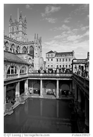 Great Bath Roman building, with Abbey in background. Bath, Somerset, England, United Kingdom (black and white)