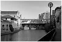 Pulteney Bridge, quay, and river Avon, late afternoon. Bath, Somerset, England, United Kingdom ( black and white)