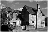 Houses with roofs made from split natural stone tiles, Lacock. Wiltshire, England, United Kingdom (black and white)