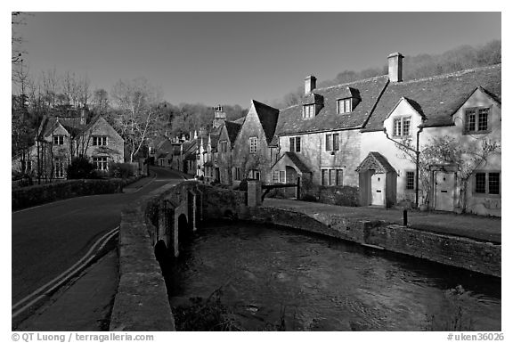 Main village street and Bybrook River, late afternoon, Castle Combe. Wiltshire, England, United Kingdom