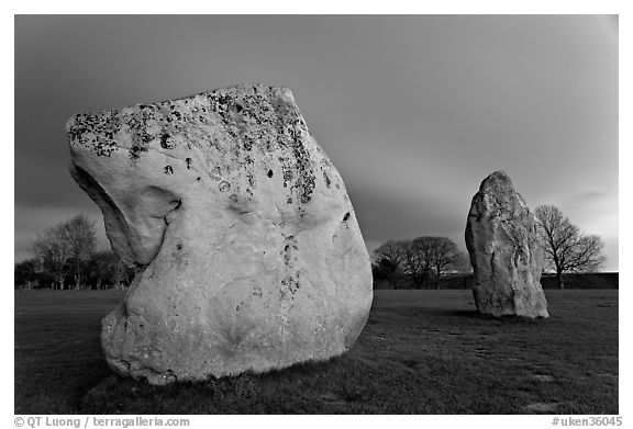 Large standing stones and brewing storm at dusk, Avebury, Wiltshire. England, United Kingdom (black and white)