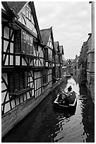Half-timbered house, canal, and rowboat. Canterbury,  Kent, England, United Kingdom (black and white)