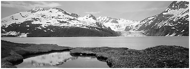 Fjord with snowy mountains. Prince William Sound, Alaska, USA (Panoramic black and white)