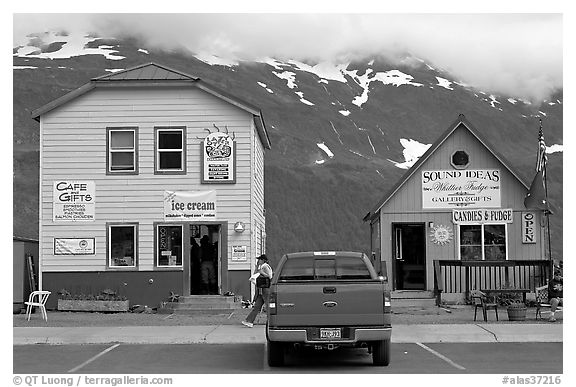 Cabins on the waterfront and red truck. Whittier, Alaska, USA (black and white)