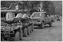Four wheelers parked on main street. McCarthy, Alaska, USA (black and white)