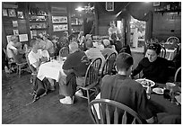 Dinner inside Mc Carthy lodge. McCarthy, Alaska, USA (black and white)