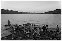 Families pickniking with fire, Resurrection Bay, sunset. Seward, Alaska, USA (black and white)