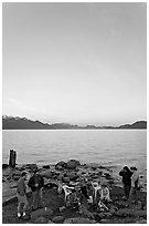 Family enjoying midnight picknik, Resurrection Bay, sunset. Seward, Alaska, USA (black and white)