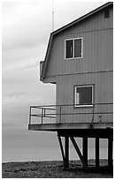 House on stilts on the Spit. Homer, Alaska, USA (black and white)