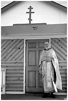 Orthodox priest ouside the old Russian church. Ninilchik, Alaska, USA (black and white)
