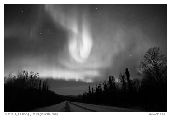Aurora curtains above road. Alaska, USA