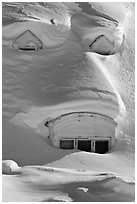 Windows on snow-covered roof. Alaska, USA ( black and white)