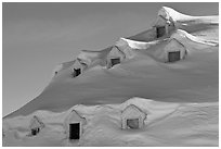 Snow-covered roof with windows. Alaska, USA ( black and white)