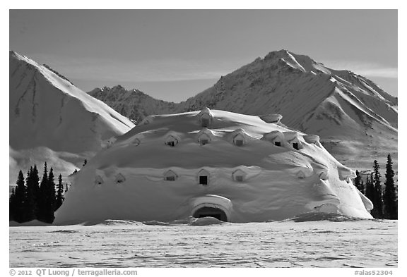 Snowy dome-shaped building and mountains. Alaska, USA (black and white)