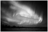 Magnetic storm in sky above snowy meadow. Alaska, USA (black and white)